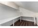 Attic storage space featuring new vinyl flooring and built-in shelving at 2040 S Longmore -- # 5, Mesa, AZ 85202