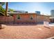 Brick home exterior with low-maintenance landscaping, palm tree, and sign in the yard at 207 E Monterey Way, Phoenix, AZ 85012