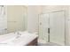 Bright bathroom featuring a vanity with a sink and a glass-door shower for a clean design at 20941 E Via Del Sol St, Queen Creek, AZ 85142