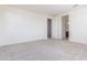 Spacious bedroom with neutral carpet and walk-in closet access provides a peaceful retreat at 20941 E Via Del Sol St, Queen Creek, AZ 85142