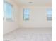 Airy bedroom with large windows providing ample natural light and neighborhood views at 20941 E Via Del Sol St, Queen Creek, AZ 85142