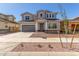 Attractive two-story house displaying well-kept landscaping, a driveway, and modern design at 20941 E Via Del Sol St, Queen Creek, AZ 85142