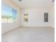 Spacious living room showcases tile flooring and many windows for optimal lighting at 20941 E Via Del Sol St, Queen Creek, AZ 85142