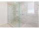 Sleek glass shower with tiled walls and floor, offering a luxurious bathing experience at 20941 E Via Del Sol St, Queen Creek, AZ 85142