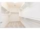 Organized walk-in closet with shelves and hanging rods, providing ample storage space at 20941 E Via Del Sol St, Queen Creek, AZ 85142