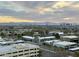 Scenic city view featuring commercial real estate, lush landscaping, and distant mountains at 2211 E Camelback Rd # 306, Phoenix, AZ 85016