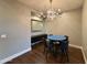 Dining room featuring a modern chandelier and blue round table with black chairs at 2211 E Camelback Rd # 306, Phoenix, AZ 85016