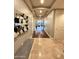 Inviting hallway with elegant decor leading into a spacious living area at 2211 E Camelback Rd # 306, Phoenix, AZ 85016