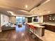 Open-concept living space with a stylish kitchen, comfortable seating, and beautiful balcony views at 2211 E Camelback Rd # 306, Phoenix, AZ 85016