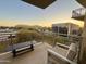 Comfortable patio area offering scenic views of the surrounding community at sunset at 2211 E Camelback Rd # 306, Phoenix, AZ 85016