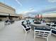 Inviting rooftop deck with a pool, cozy lounge chairs, and a central fire pit at 2211 E Camelback Rd # 306, Phoenix, AZ 85016