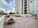 Spacious rooftop deck area showcasing pavers, plantings, and benches, offering a relaxing outdoor space at 2211 E Camelback Rd # 306, Phoenix, AZ 85016