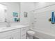 Bright bathroom featuring a shower-tub combination and a white single sink vanity at 24385 N 173Rd Ln, Surprise, AZ 85387