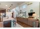 Open-concept design with kitchen island flowing into a living space with staircase at 25846 N 108Th Ave, Peoria, AZ 85383