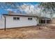 Large backyard with a view of the home's exterior featuring a covered parking area at 2904 W Coolidge St, Phoenix, AZ 85017