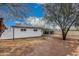 Large backyard with a view of the home's exterior featuring a covered parking area at 2904 W Coolidge St, Phoenix, AZ 85017