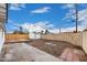Spacious backyard with a concrete patio, potential for landscaping, and secure fencing at 2904 W Coolidge St, Phoenix, AZ 85017