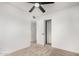 Comfortable bedroom with neutral carpet, a ceiling fan, and closet access at 2904 W Coolidge St, Phoenix, AZ 85017