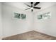 Clean bedroom with neutral carpet and two windows providing natural light at 2904 W Coolidge St, Phoenix, AZ 85017