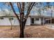 Charming exterior of this newly renovated home featuring a covered parking area and spacious front yard at 2904 W Coolidge St, Phoenix, AZ 85017