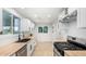 Well-lit kitchen featuring butcher block countertops, stainless steel appliances, and white cabinetry at 2904 W Coolidge St, Phoenix, AZ 85017