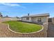 Green backyard with a brick trim and views of the block fence at 2958 E Contessa St, Mesa, AZ 85213