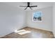 Clean bedroom with a ceiling fan, tile floors, and a window overlooking the neighborhood at 2958 E Contessa St, Mesa, AZ 85213