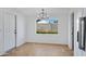 Bright dining area with neutral paint and natural light from a window overlooking the backyard at 2958 E Contessa St, Mesa, AZ 85213