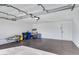 Spacious two-car garage with epoxy flooring, and ample storage space at 2958 E Contessa St, Mesa, AZ 85213