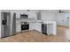Modern kitchen featuring stainless steel appliances, white cabinets, and bright lighting at 2958 E Contessa St, Mesa, AZ 85213