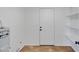 Bright laundry room with tile floors, shelving and a white door at 2958 E Contessa St, Mesa, AZ 85213