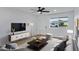 Cozy living room featuring a ceiling fan, TV, and comfortable seating at 2958 E Contessa St, Mesa, AZ 85213