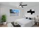 Bright main bedroom features a ceiling fan and a large window at 2958 E Contessa St, Mesa, AZ 85213