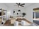 Bright home office with modern desk setup and access to backyard patio at 2958 E Contessa St, Mesa, AZ 85213