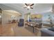 Open living room showcasing neutral walls, tile flooring, and seamless transition into the kitchen and dining areas at 29903 N 127Th Ave, Peoria, AZ 85383