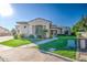 Charming single-story home featuring stucco siding, tiled roof, manicured lawn and mature landscaping at 3010 E Cedar Dr, Chandler, AZ 85249