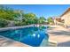 Refreshing pool with a large deck, manicured landscaping and multiple seating areas for ultimate outdoor enjoyment at 3010 E Cedar Dr, Chandler, AZ 85249