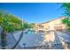 An expansive pool offers a refreshing escape, surrounded by lush greenery and a large patio area at 3010 E Cedar Dr, Chandler, AZ 85249