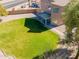 Aerial shot of backyard with lush lawn, covered patio, and desert landscaping at 30263 N Bobcat Way, San Tan Valley, AZ 85143