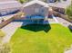 Aerial view of the backyard with the house, patio, and block wall fencing at 30263 N Bobcat Way, San Tan Valley, AZ 85143