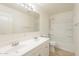 A full bathroom with double sinks, mirror, and shower-tub combo at 30263 N Bobcat Way, San Tan Valley, AZ 85143