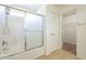 A full bathroom that includes a shower-tub combo and a door to a walk in closet at 30263 N Bobcat Way, San Tan Valley, AZ 85143