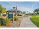 Community gazebo with picnic tables offers a pleasant gathering spot amidst green lawns and walking paths at 30263 N Bobcat Way, San Tan Valley, AZ 85143
