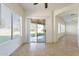 Dining area featuring tile floors, neutral walls, a sliding glass door, and lots of natural light at 30263 N Bobcat Way, San Tan Valley, AZ 85143