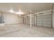 Spacious three car garage with high ceilings and a water heater at 30263 N Bobcat Way, San Tan Valley, AZ 85143