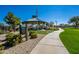 Picturesque gazebo in a well-maintained community park, complete with a walking path and seating at 30263 N Bobcat Way, San Tan Valley, AZ 85143