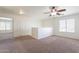 Open loft area featuring neutral carpet, a ceiling fan, and a closet at 30263 N Bobcat Way, San Tan Valley, AZ 85143