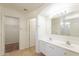 The main bathroom is equipped with double sinks and a walk in closet at 30263 N Bobcat Way, San Tan Valley, AZ 85143