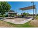 Community playground with swings, slides, and covered seating area for residents to enjoy at 30263 N Bobcat Way, San Tan Valley, AZ 85143