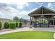 Fenced pool with a gazebo is surrounded by greenery, offering a relaxing spot within the community at 30263 N Bobcat Way, San Tan Valley, AZ 85143